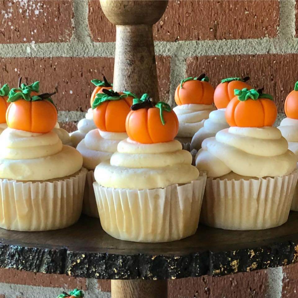 Vanilla cupcakes with pumpking candy on top