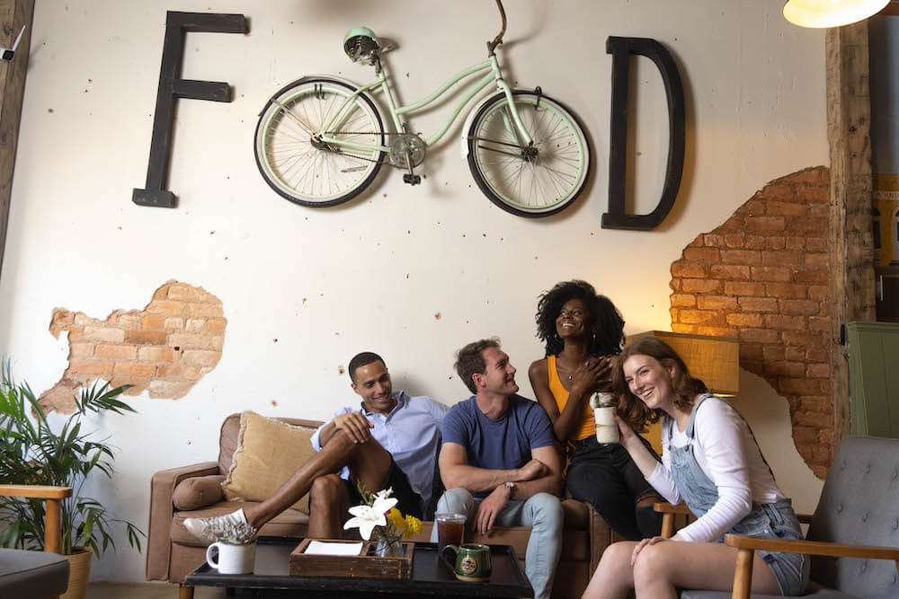 Friends sharing coffee and laughing