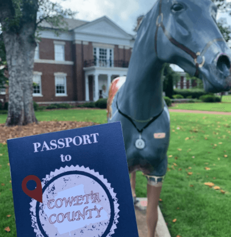 Passport image in front of McRitchie-Hollis Museum